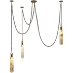 Three-head Clérachic Alabaster Capsule Pendant Light seen against white, the draped chains crossing between the ceiling plates.
