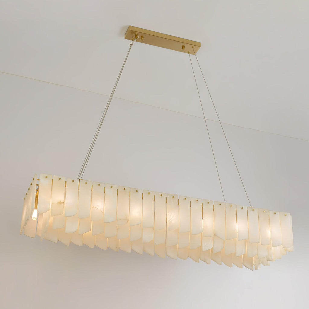 Clérachic cascade chandelier in its long linear form, alabaster blades along a brass bar.