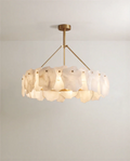 Clérachic round chandelier with irregular white alabaster panels on a brass ring, hung from three brass arms and a round canopy.