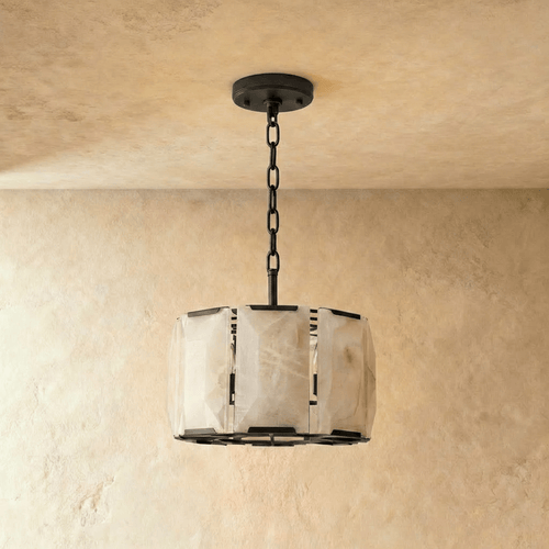 Clérachic faceted alabaster drum chandelier in matte black, 48 cm size, shown unlit against warm plaster