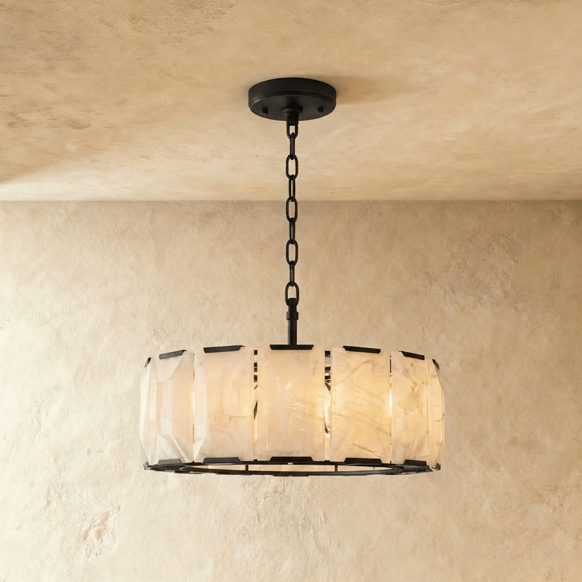 Clérachic round alabaster chandelier, 78 cm wide, in matte black, hung on a black chain from a round canopy