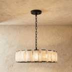 Clérachic ring chandelier of veined alabaster panels in matte black, 107 cm wide, glowing softly on its chain