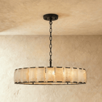 Clérachic wide alabaster ring chandelier, 147 cm across, in matte black with a long chain above a plaster wall
