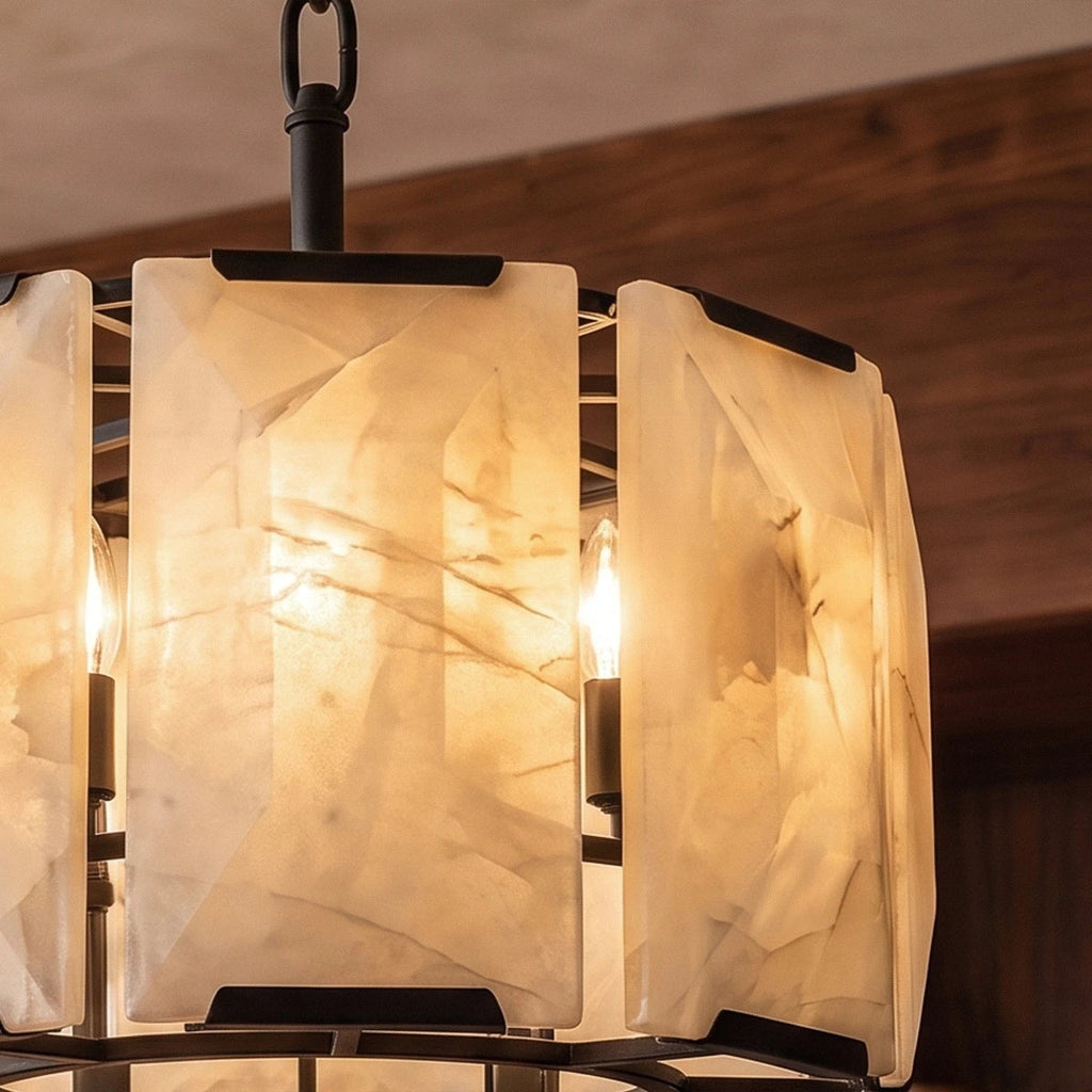 Close view of Clérachic alabaster panels in matte black frame, showing natural veining and candle bulbs inside
