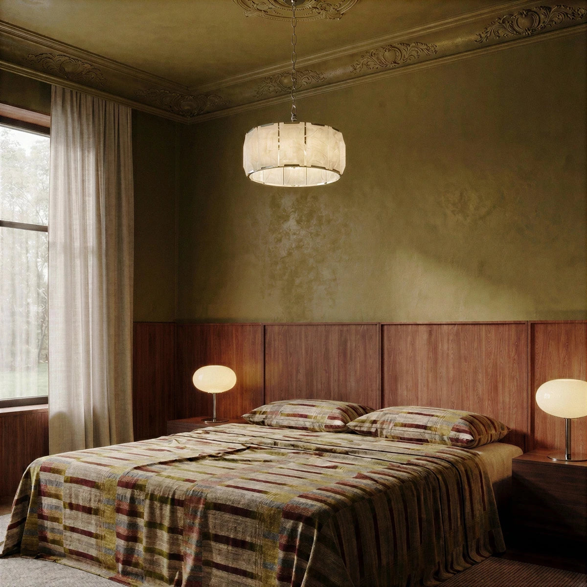 Clérachic alabaster ring chandelier in polished steel above a bed in a bedroom with olive plaster walls