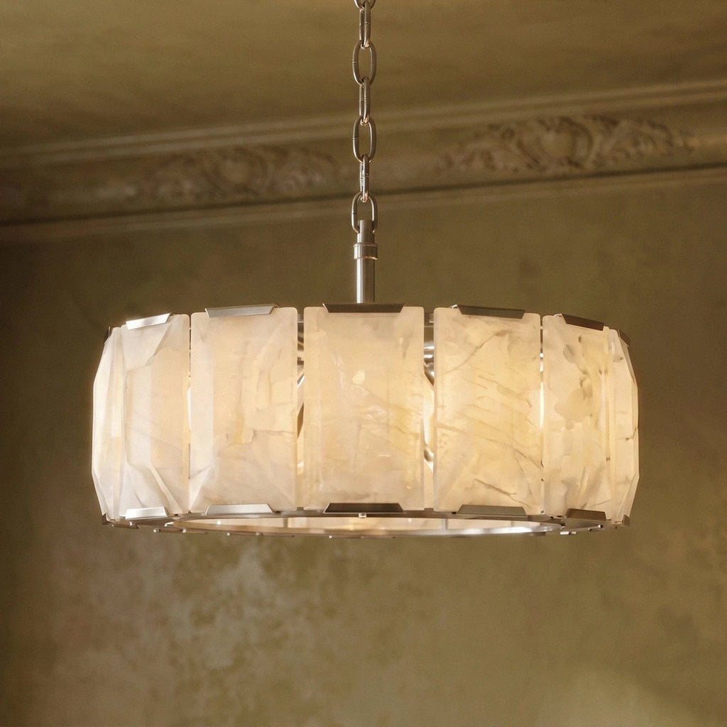 Clérachic alabaster chandelier close up, with lit veined panels, steel clips and a chain below a cornice