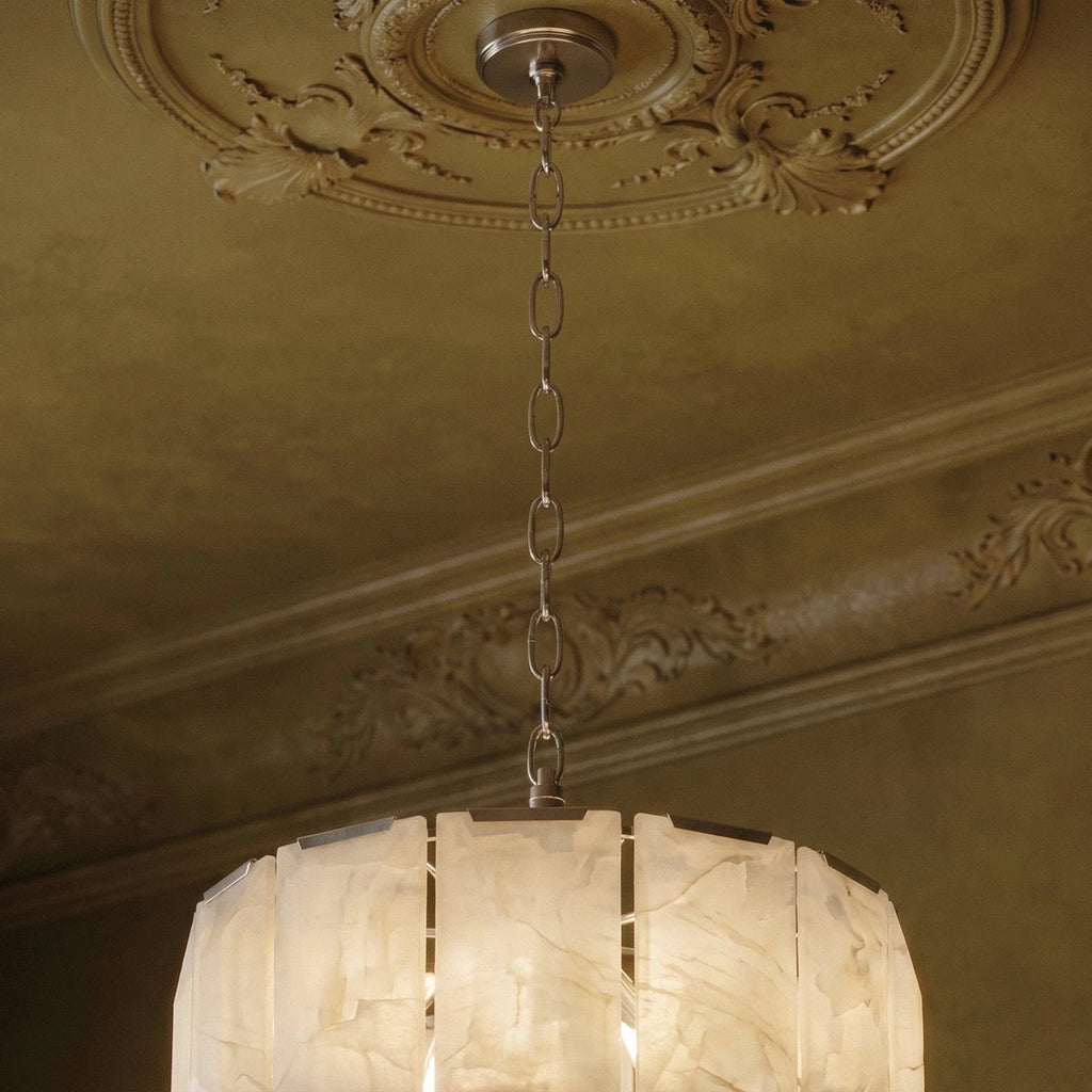Clérachic polished steel chandelier chain and canopy beneath an ornate ceiling rose, over glowing alabaster panels