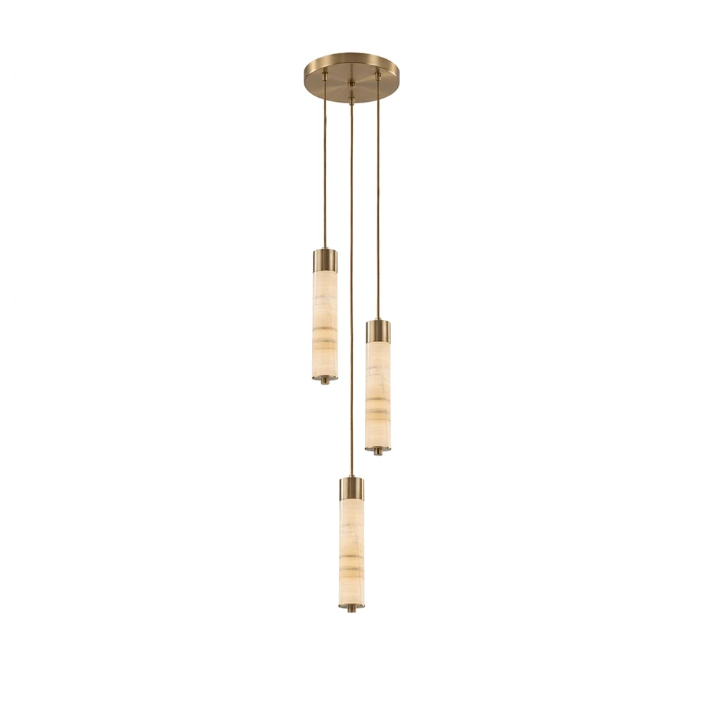 Two brass-capped alabaster columns glow warm on this Clérachic chandelier, staggered at different heights on a plain background.