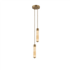 Two brass-capped alabaster columns on this Clérachic chandelier hang close together, glowing warm on a plain background.