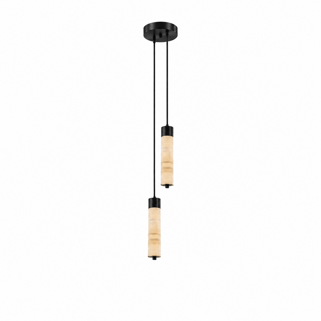 Two black-capped alabaster columns on this Clérachic chandelier hang at different lengths, glowing warm on a plain background.