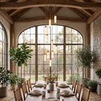 A tall cascade of this Clérachic chandelier's alabaster columns glows warm beneath timber beams in an arched dining room.