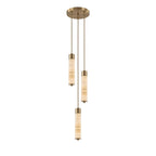 Three brass-capped alabaster columns glow warm on this Clérachic chandelier, staggered at different heights on a plain background.