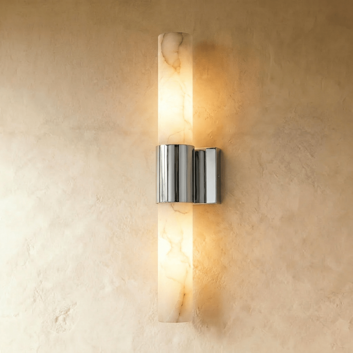 Clérachic 60 cm wall sconce with a glowing alabaster column and a mirror-bright polished nickel band on limewash.