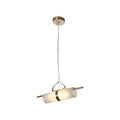 Full drop of the Clérachic Alabaster Cylinder LED Pendant Light on white, copper through-rod running the length of the glowing stone.