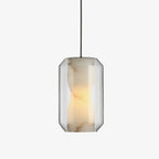 Front view of this Clérachic alabaster pendant on a plain light backdrop, a veined stone cylinder glowing warm inside a clear faceted glass shell.