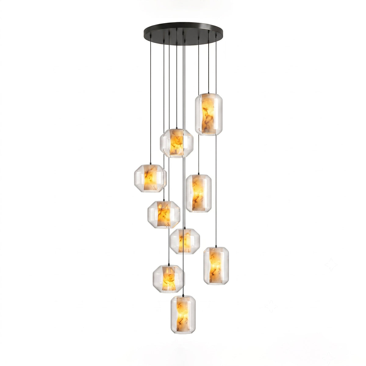 A larger cluster of clear glass Clérachic pendants with amber-lit alabaster hangs at staggered heights from a round black canopy on white.