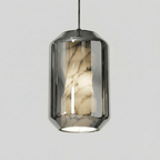 A tall Clérachic pendant with a smoke grey glass shell, its veined alabaster column visible inside, on a plain light grey backdrop.