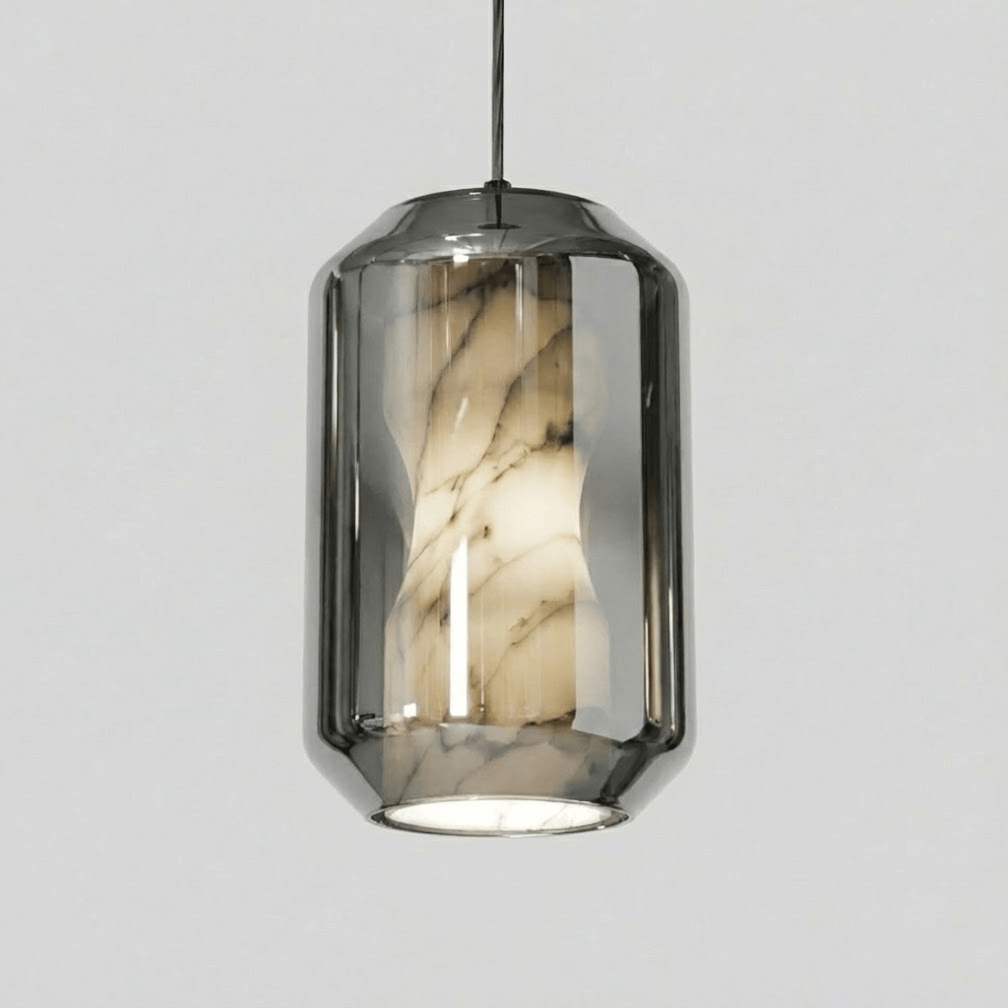A tall Clérachic pendant with a smoke grey glass shell, its veined alabaster column visible inside, on a plain light grey backdrop.