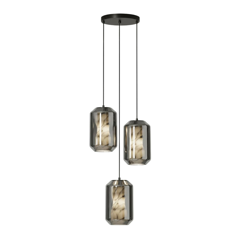 Three tall smoke grey glass Clérachic pendants hang at staggered heights from a round black canopy on a white backdrop.