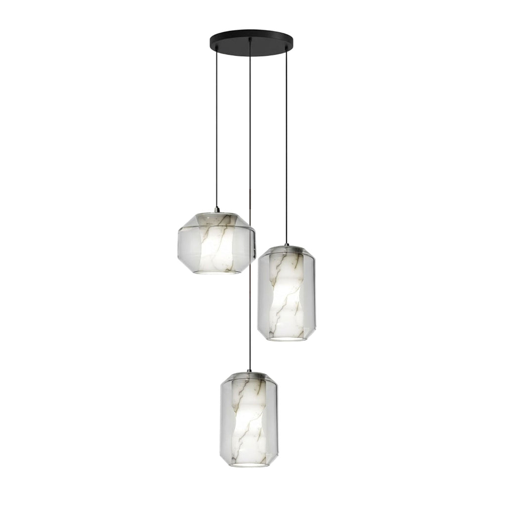 Three Clérachic pendants with clear glass and white alabaster, one wide and two tall, hang from a round black canopy on a white backdrop.