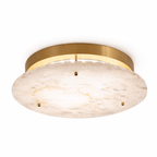 Clérachic alabaster ceiling disc with a brass canopy and a ring of small LEDs, shown on a plain white backdrop.