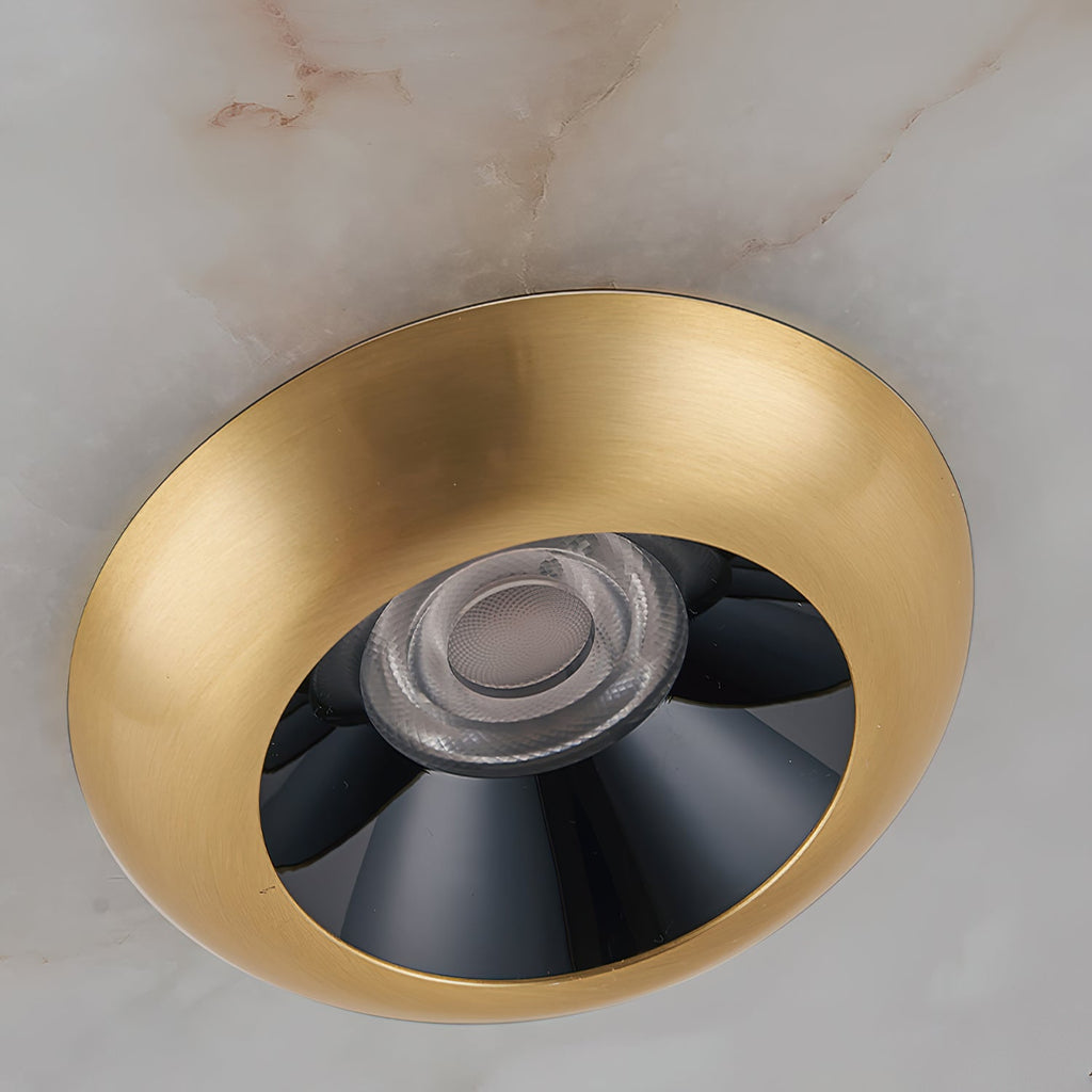 Integrated LED module recessed inside the brass bowl of the Clérachic Alabaster Disc Pendant Light, seen from directly below.
