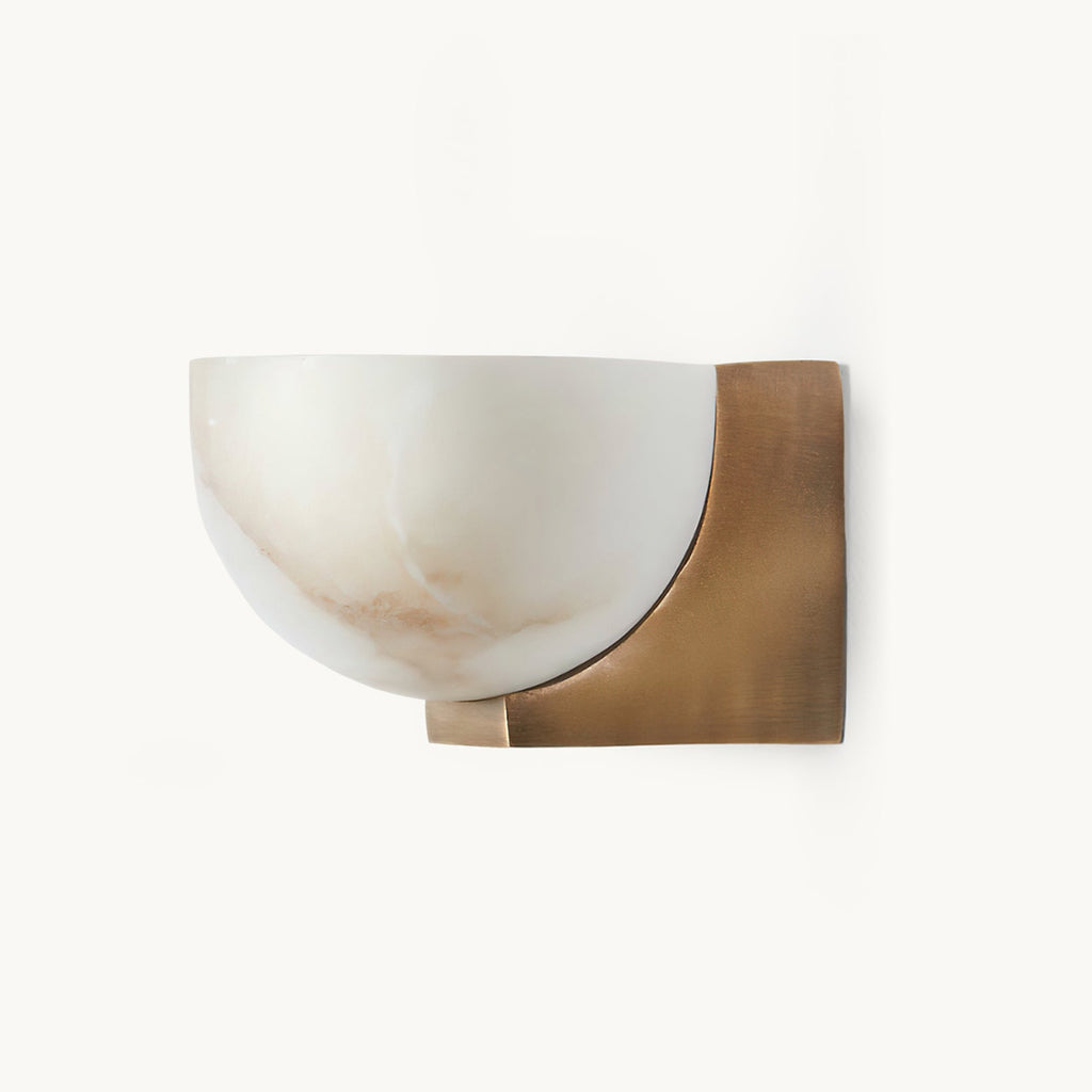 Clérachic alabaster dome wall light with a brass bracket, shown on a plain white backdrop with soft veining in the stone.