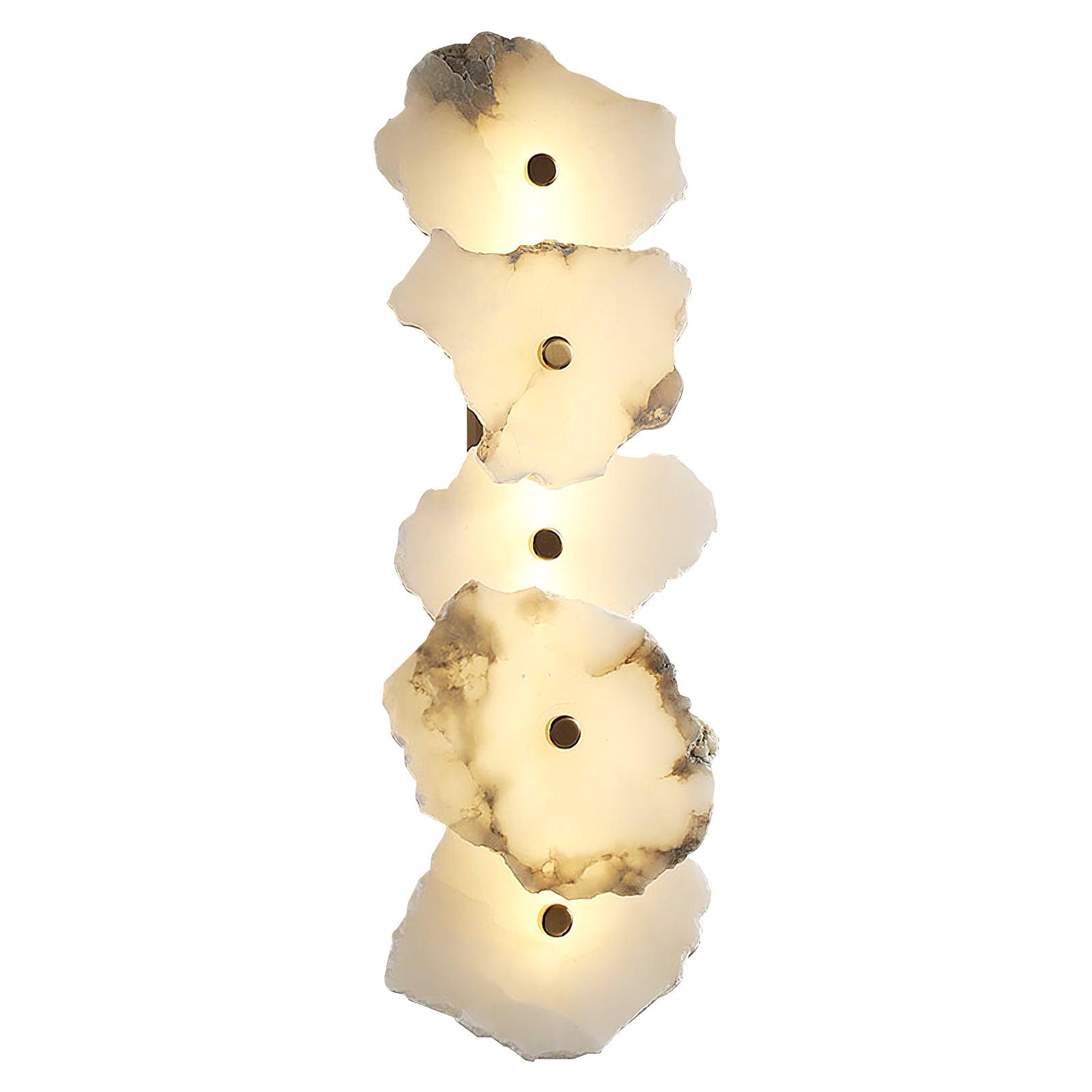 The Clérachic five-head alabaster lamp shown against white, its stone shades glowing warm and even.