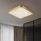 Square Clérachic alabaster flush ceiling light lit on a grey ceiling beside fluted glass screens and floor-length curtains.