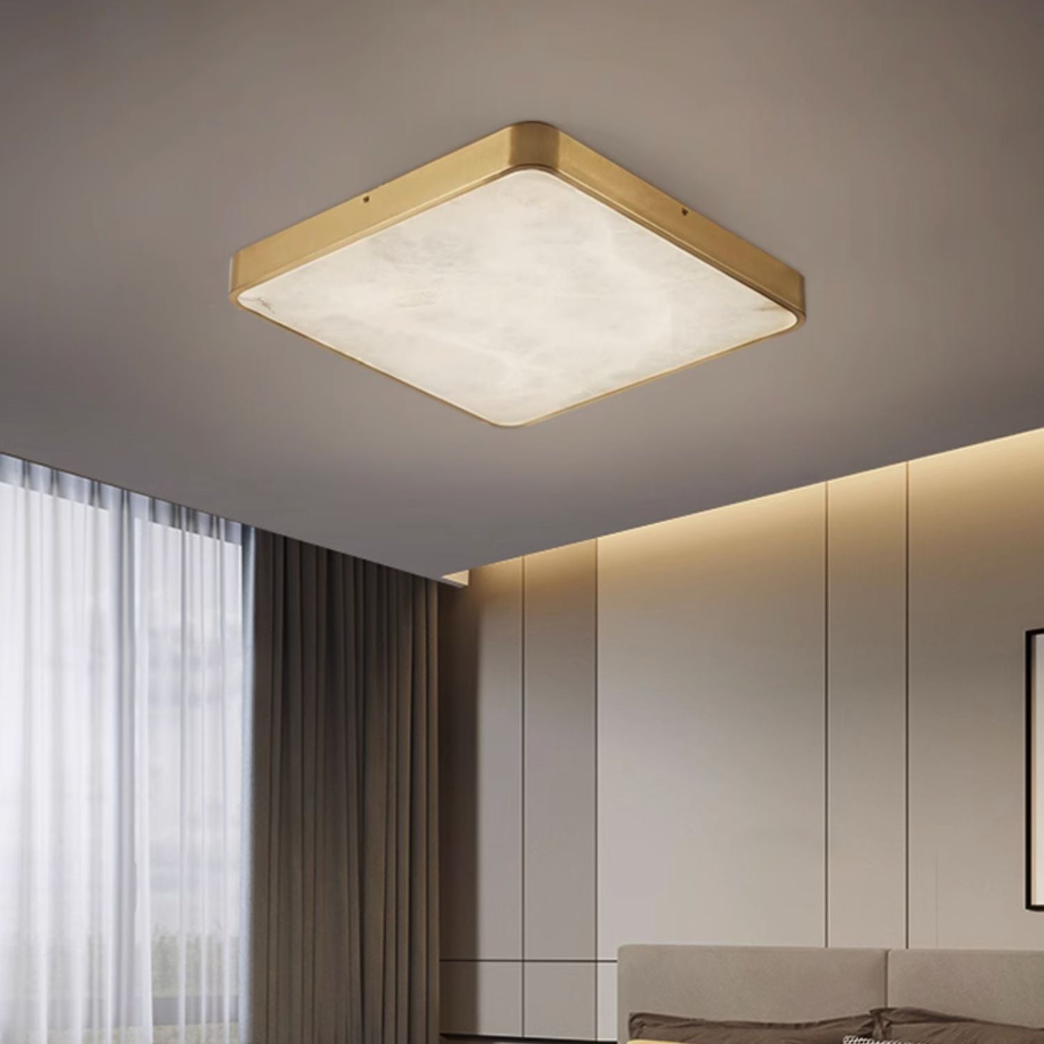 Square Clérachic alabaster flush ceiling light lit in a bedroom, sitting flat on the ceiling near cove-lit joinery.