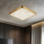 Square Clérachic alabaster flush ceiling light on a textured ceiling, glowing above dark timber panelling and curtains.