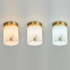 Three Clérachic alabaster cylinder ceiling lights side by side showing warm, neutral and cool light from different G9 bulbs