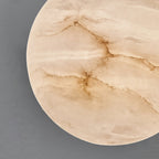Macro detail of the Clérachic alabaster shade, natural stone veining and translucent grain filling the frame