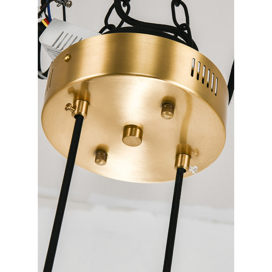 Round brass ceiling canopy of the Clérachic Alabaster Globe Chandelier, hardwired with the suspension cords fitted.