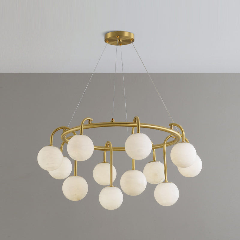 The twelve-light Clérachic Alabaster Globe Chandelier hung on four slim cables from its flush round canopy, seen against plain grey.