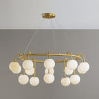 Clérachic Alabaster Globe Chandelier at its widest fifteen-light size, the brass ring circled with alabaster spheres on two levels.