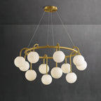 Clérachic Alabaster Globe Chandelier against a dark charcoal wall, where the honey veining through each stone globe reads clearly.