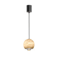 Studio view of the Clérachic Alabaster Globe Pendant Light, a brass band under the stone globe holding the clear stepped lens that beams down.