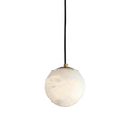 Clérachic Alabaster Globe Pendant Light on its black cord, the unlit stone showing soft grey veining against a white studio backdrop.