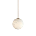 The Clérachic Alabaster Globe Pendant Light on the rigid brass rod, holding the unlit stone globe at a fixed height in a studio shot.