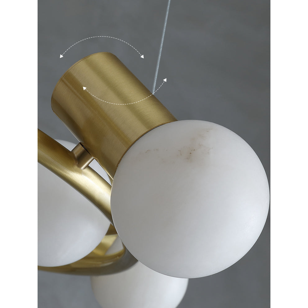 Close-up of a Clérachic Alabaster Globe Ring Chandelier head, arrows showing how the brushed brass socket pivots on the ring.
