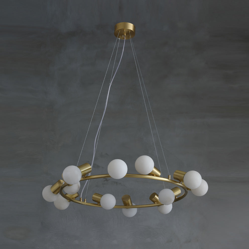 The full Clérachic Alabaster Globe Ring Chandelier suspended on three fine cables, stone globes unlit against grey plaster.