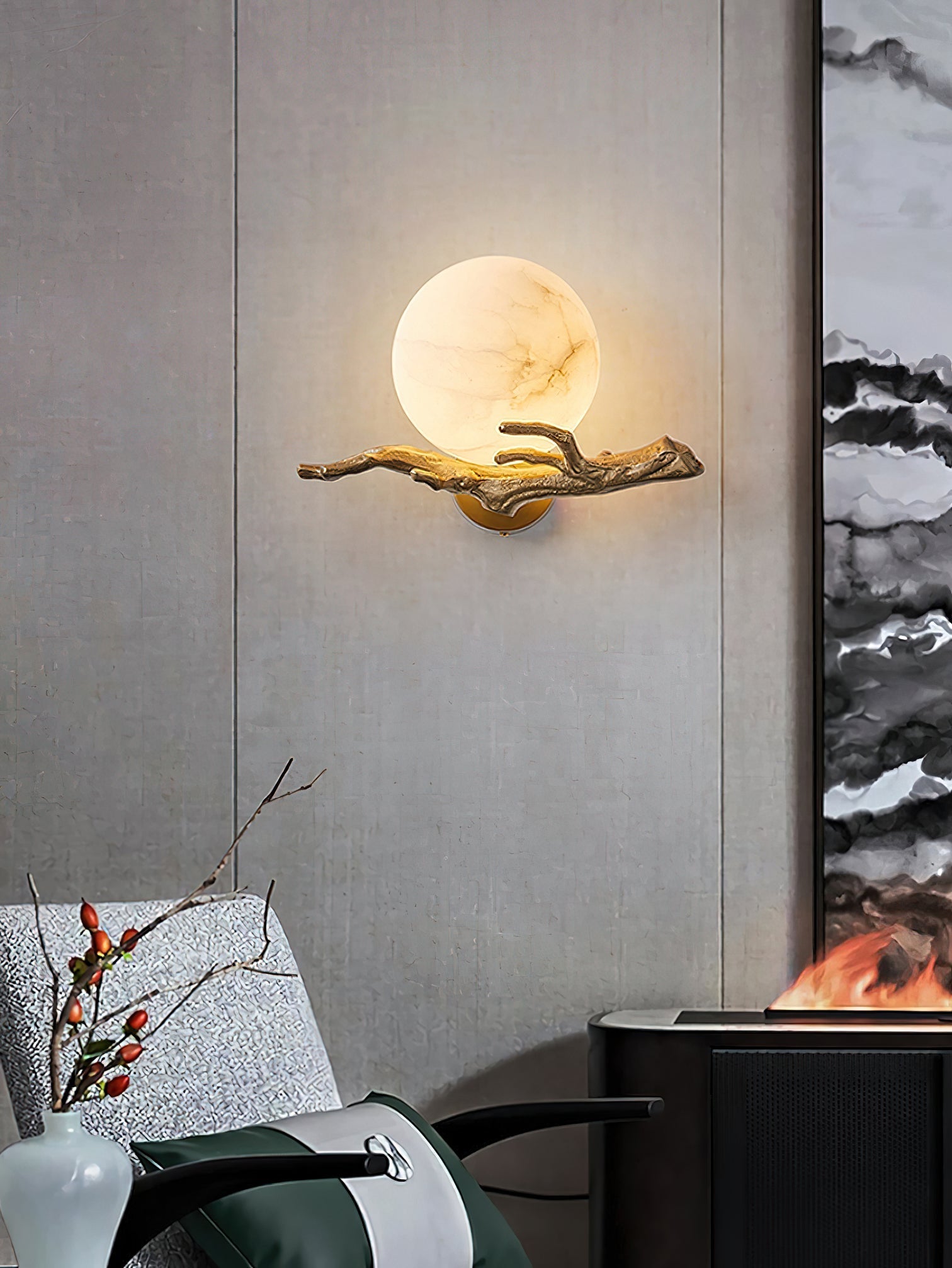 Clérachic Alabaster Globe Wall Sconce lit against a pale limewashed panel, the brass branch throwing a fine shadow across the wall.
