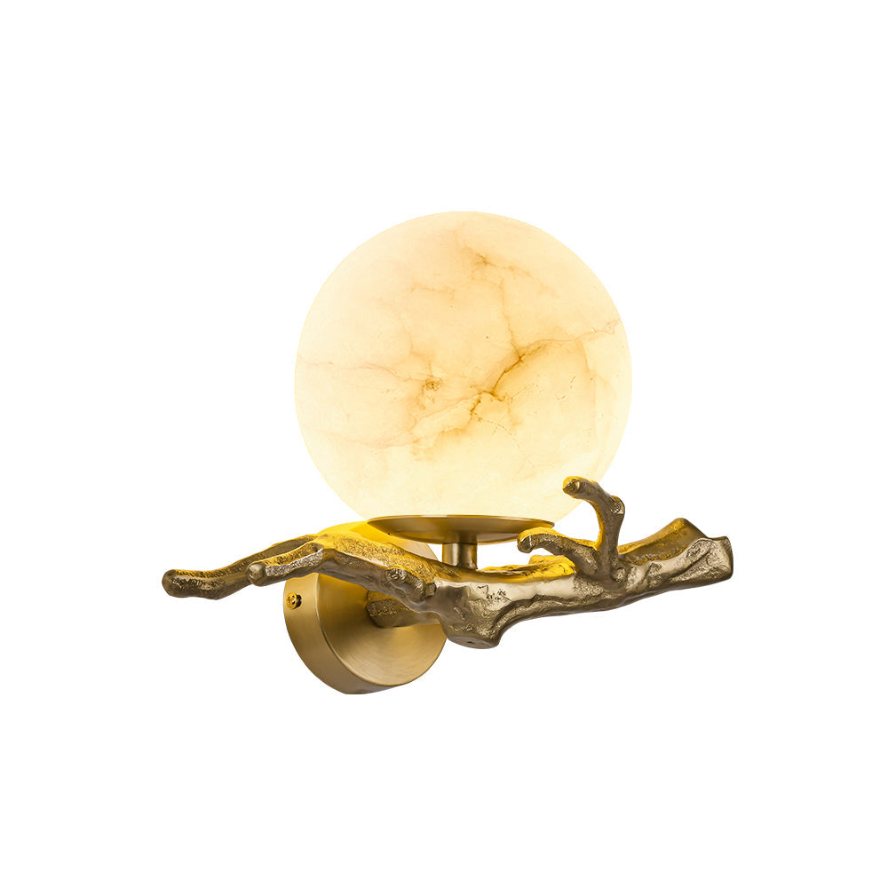 Clérachic Alabaster Globe Wall Sconce on a plain white ground, warm stone ball seated on the round backplate and cast branch.