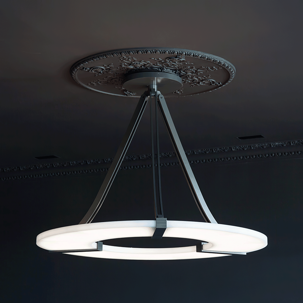 Clérachic halo pendant hung below an ornate ceiling rose in a dark panelled room.