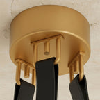 Clérachic gold ceiling canopy from below, with three black leather straps hooked to gold loops on a textured plaster ceiling.