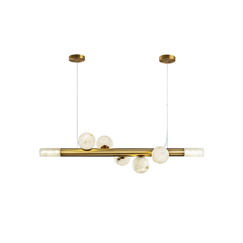 Clérachic Alabaster Linear Bar Pendant Light in the five-globe length, shown on white so the brass line reads end to end.