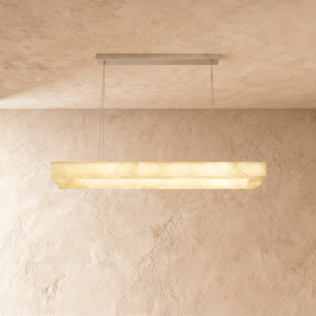 Clérachic long rectangular alabaster chandelier with a stepped stone shade, glowing evenly against plaster.