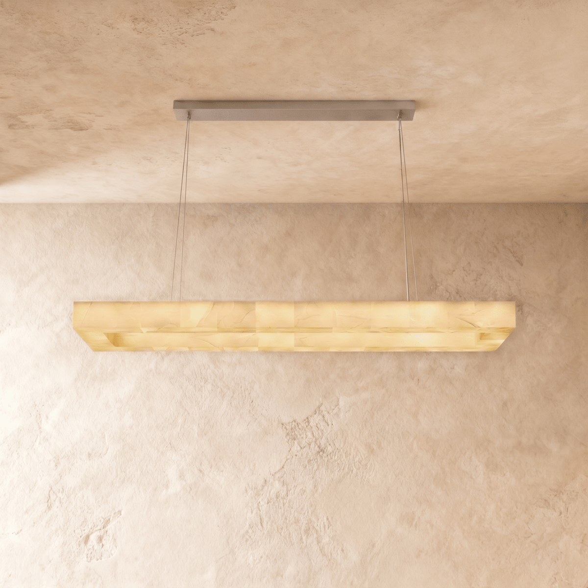 Clérachic longest rectangular alabaster chandelier, a stepped stone shade on slender cables in a warm light.