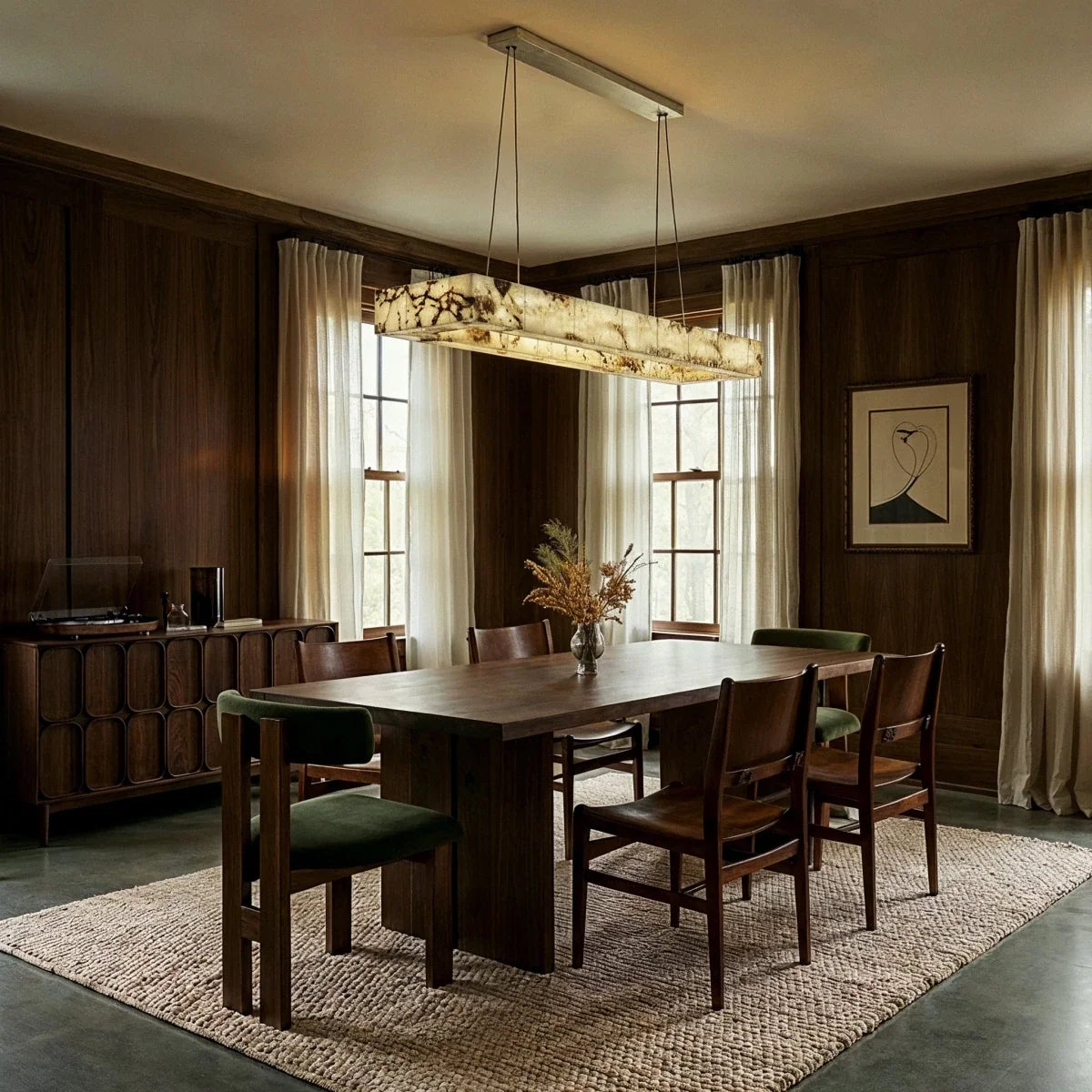 Clérachic rectangular alabaster chandelier over a walnut dining table in a panelled room with linen curtains.